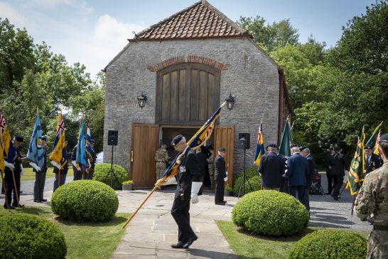 The onsite chapel hosts a remembrance service, filled with attendees paying their respects.