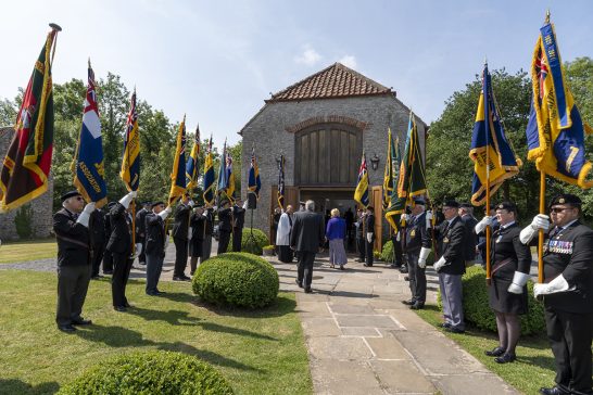 Air Marshall Sir David Walker and Colonel Jane Thompson enter the chapel, preparing to pay their respects during the Annual Service of Remembrance.